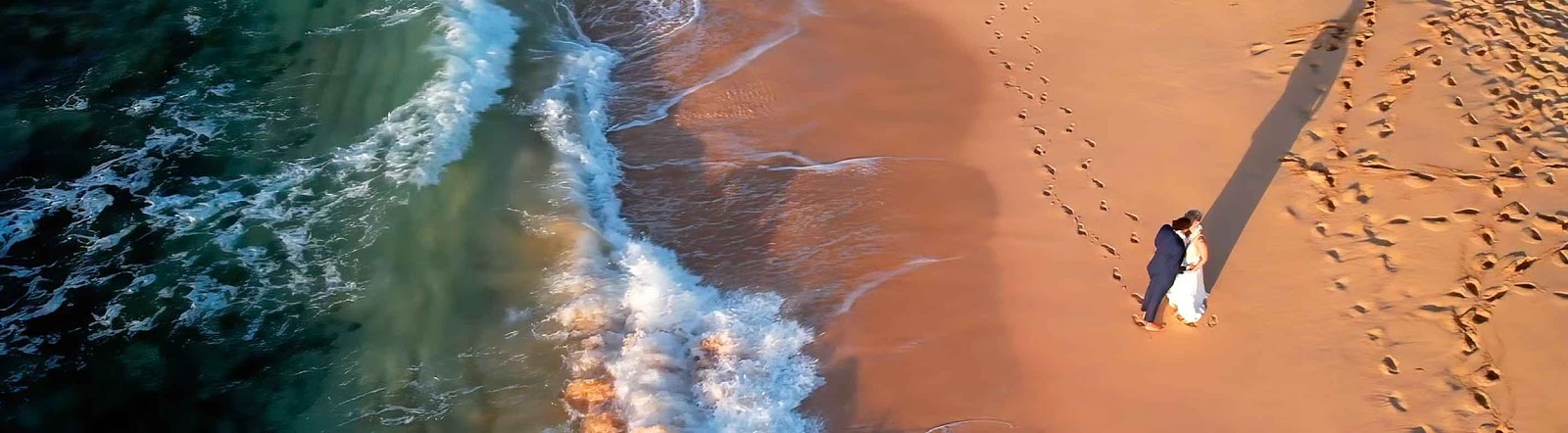 Drone shot of a wedding couple on a beach in Hawaii