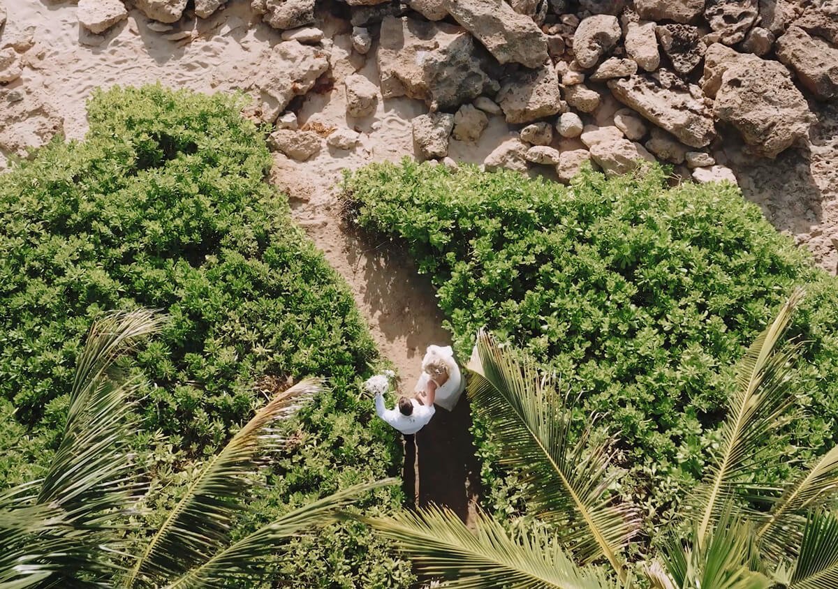 Walking to the beach after their Paradise Cove Crystal Chapel wedding