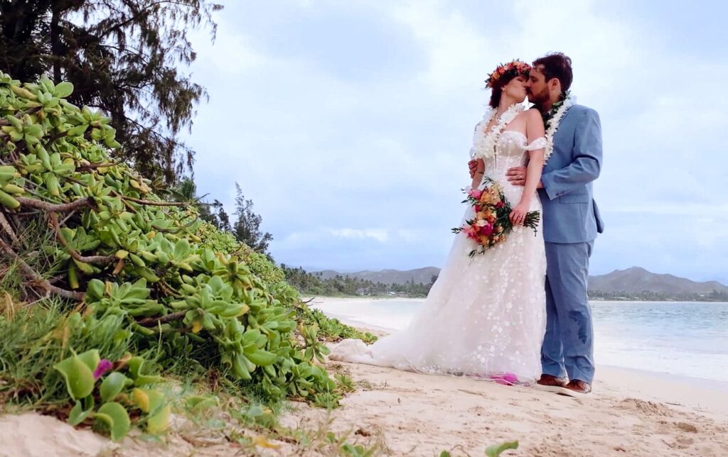 Wedding couple on the beach after their wedding at Male'ana Gardens